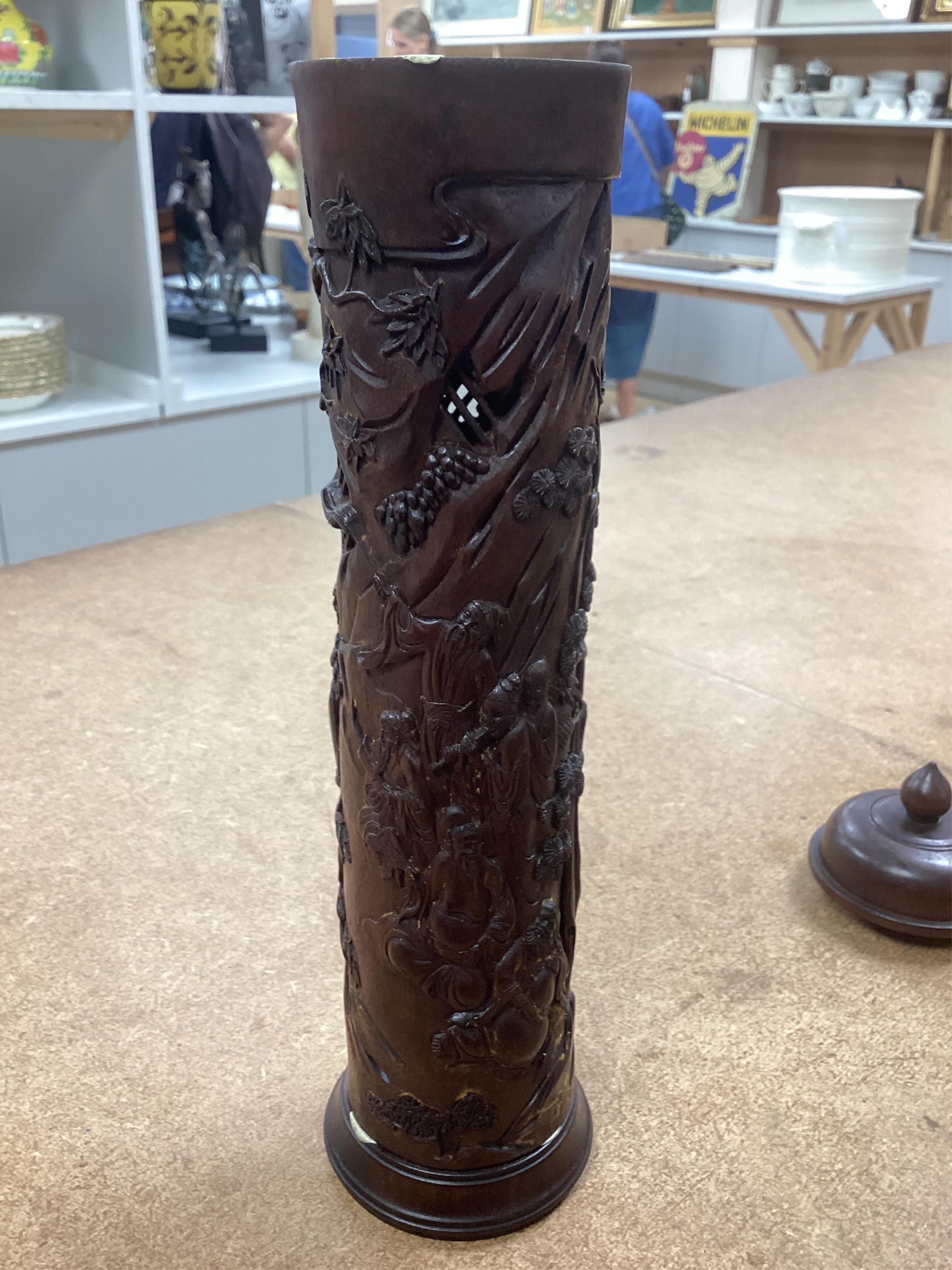 A pair of Chinese hardwood incense holders carved with trees and figures, cased, 29cm high. Condition - good